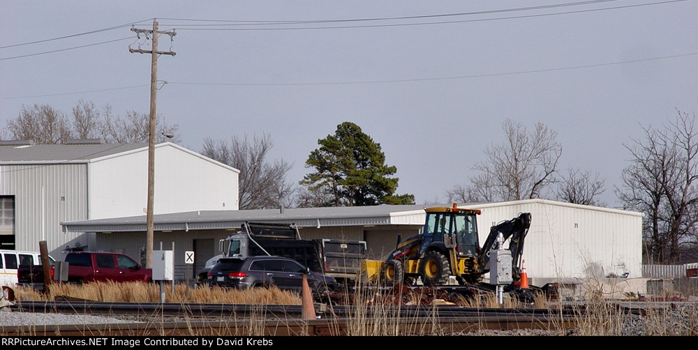 Second dump truck & backhoe/front end loader.